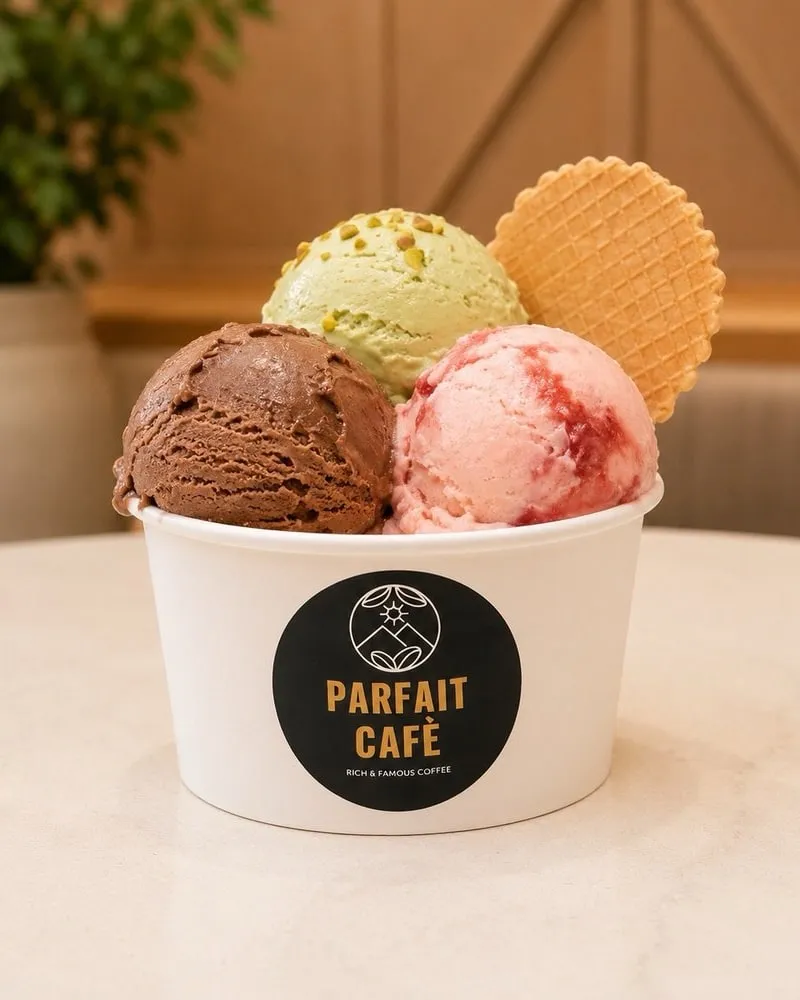 Three scoops of gelato in a Parfait Café cup with wafers